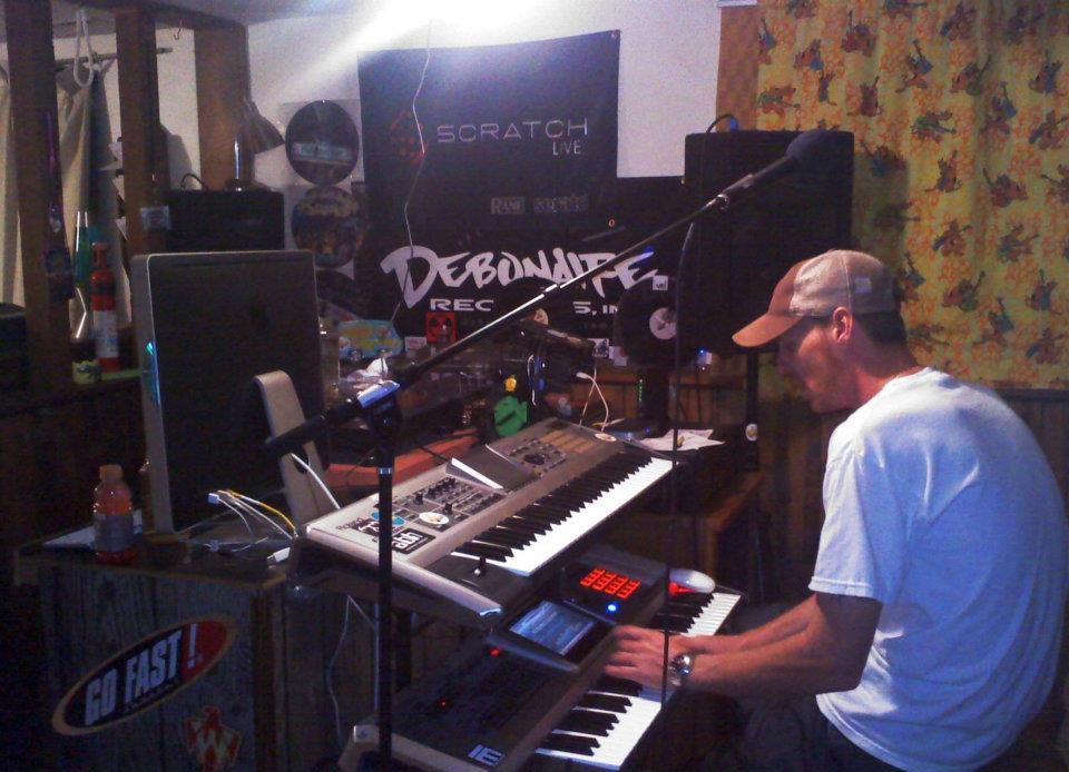 DJ Natural Nate® in his studio with keyboards and gear